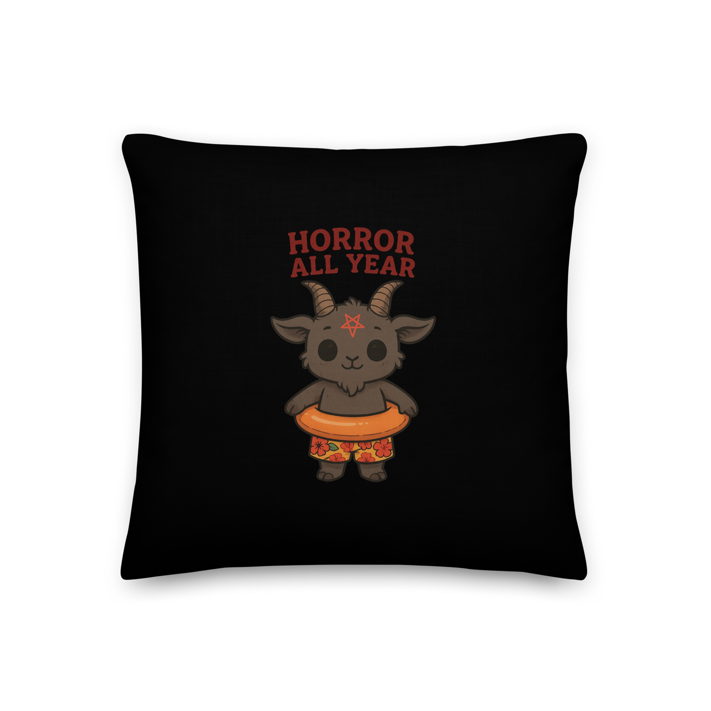 This is a black pillow and on the front has a cartoon illustration of a baby Baphomet goat with curved horns and a playful grin, wearing bright floral swim trunks while floating in a colorful inner tube. The character is set against a light background with the bold text “Horror All Year” above in red letters