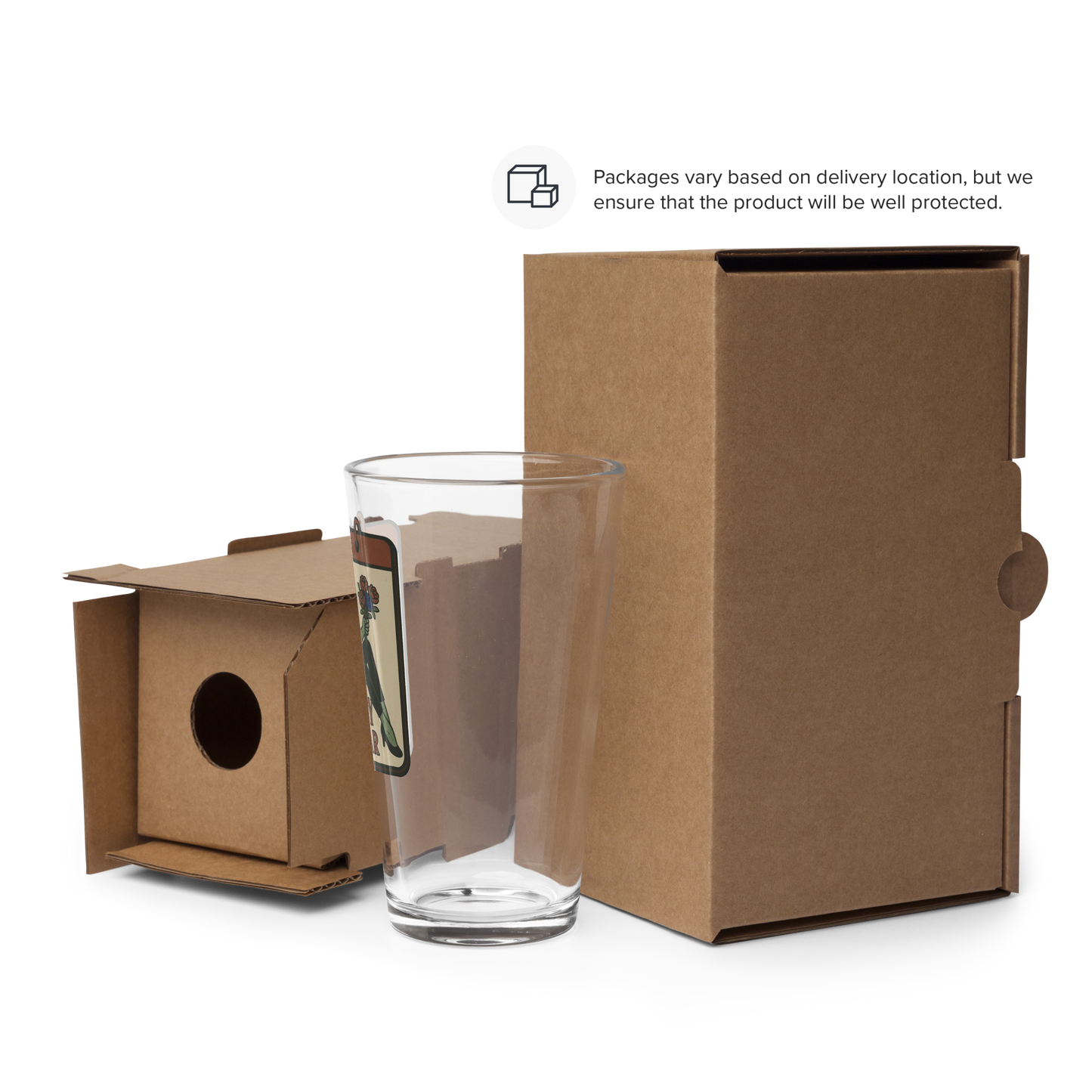 Glass with a cardboard packaging box. The pint glass design features a green pinup-style zombie girl holding flowers, with a banner underneath that reads “CREEPY ALL YEAR.”