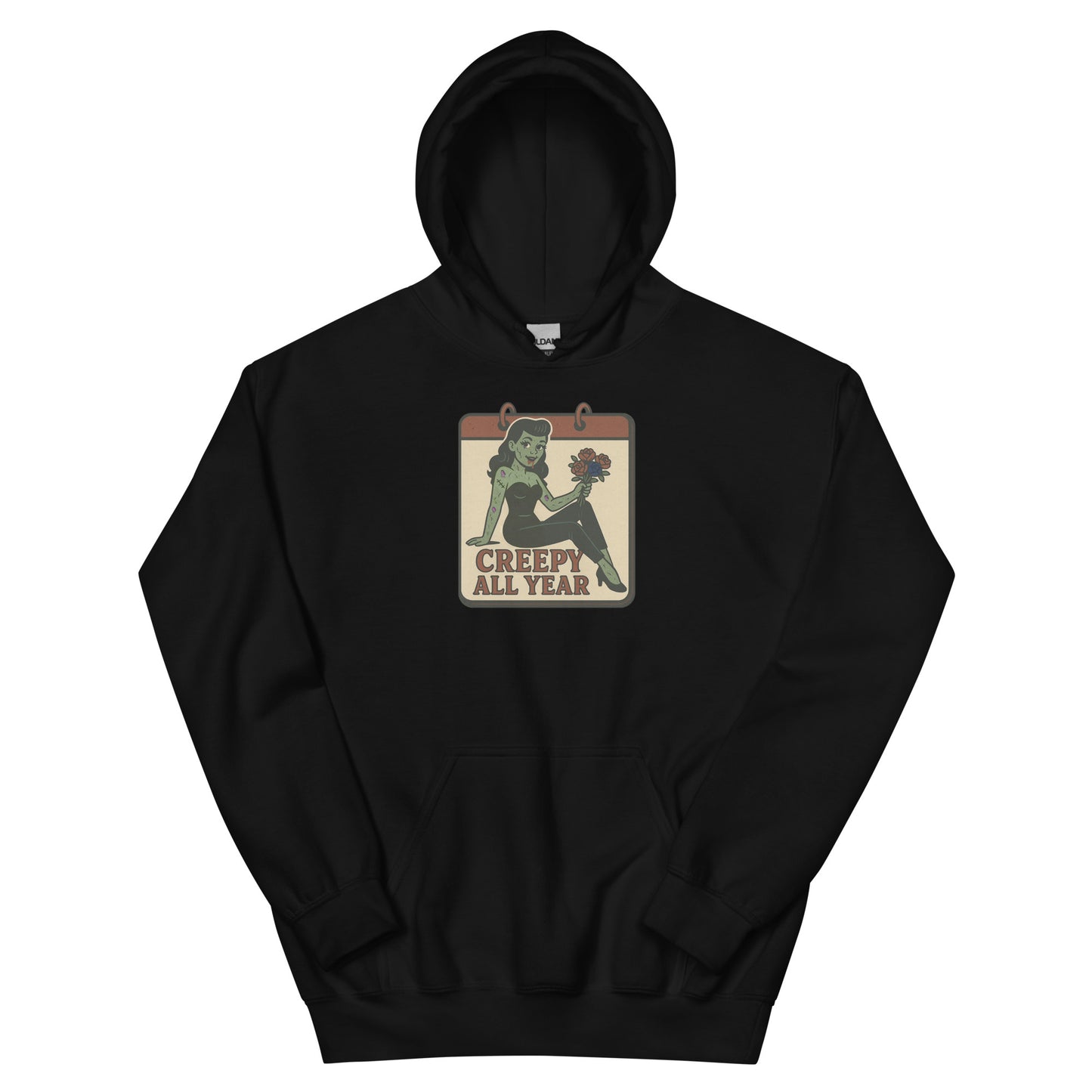A black hoodie with a vintage-style design on the front. The design features a green pinup-style zombie girl holding flowers, with a banner underneath that reads “CREEPY ALL YEAR.”
