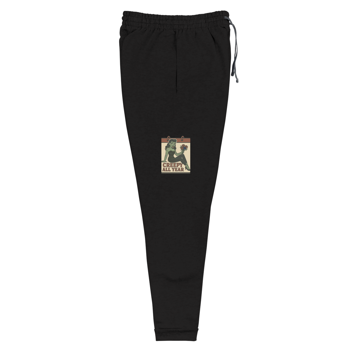 Black joggers with a vintage-style design on the front. The design features a green pinup-style zombie girl holding flowers, with a banner underneath that reads “CREEPY ALL YEAR.”