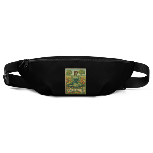 This is a black waist bag fanny pack with a design illustration of a sassy zombie pinup girl standing in a floral field, wearing tattered lingerie and flipping off the viewer with both hands. She has green skin, vintage curls, and a bold attitude. The design blends horror and humor, with a pastel color palette and creepy cute vibes