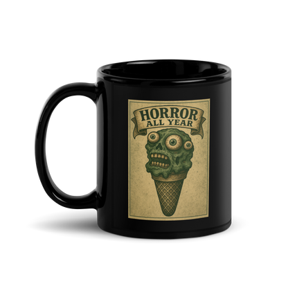 This is a black mug with a vintage-style illustration of a zombie-themed ice cream cone with a green, melting undead face and bulging eyeballs. Above the cone, a horror banner reads "Horror All Year" on a distressed parchment background