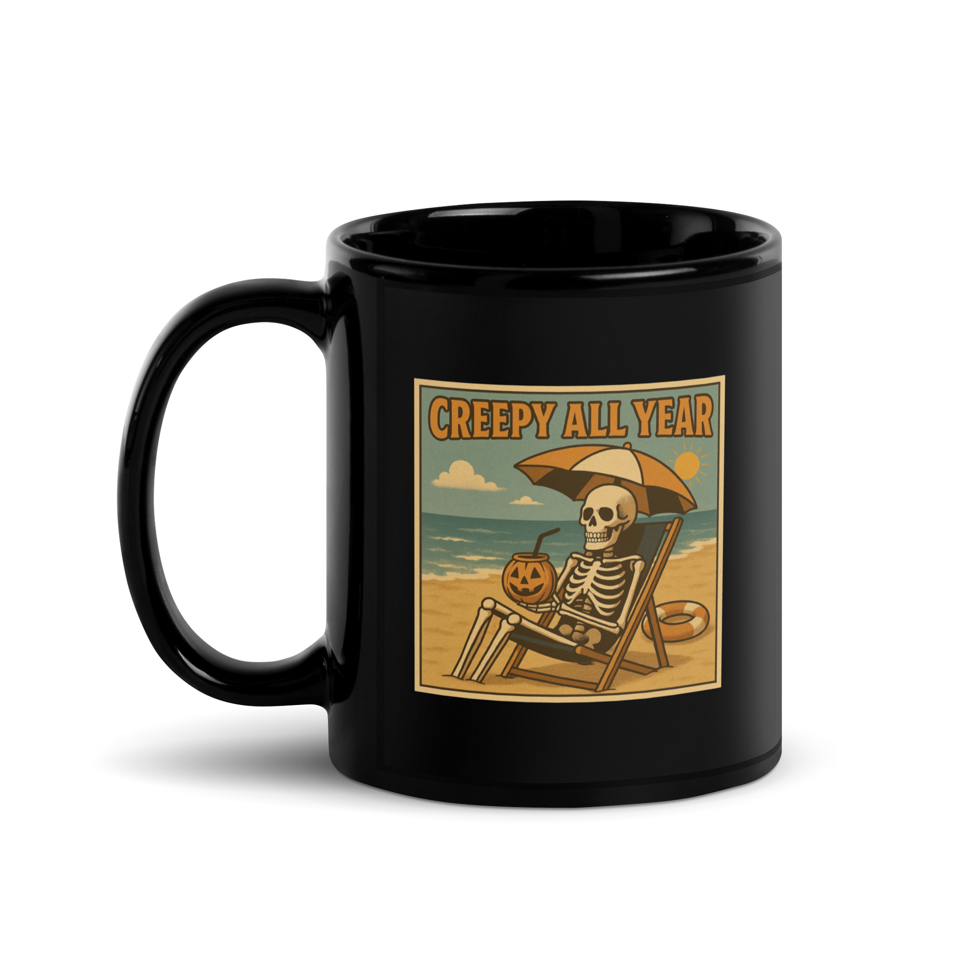 This is a black glossy mug with a retro-style illustration of a grinning skeleton lounging on a beach chair under an orange umbrella. The skeleton is holding a pumpkin-shaped drink cup with a straw and relaxing by the ocean, with a bright sun in the sky and a life preserver in the sand. The words “Creepy All Year” appear boldly at the top on the front side
