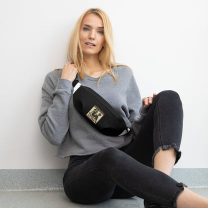 Black shoulder pack with a graphic design. The design features a green pinup-style zombie girl holding flowers, with a banner underneath that reads “CREEPY ALL YEAR.”