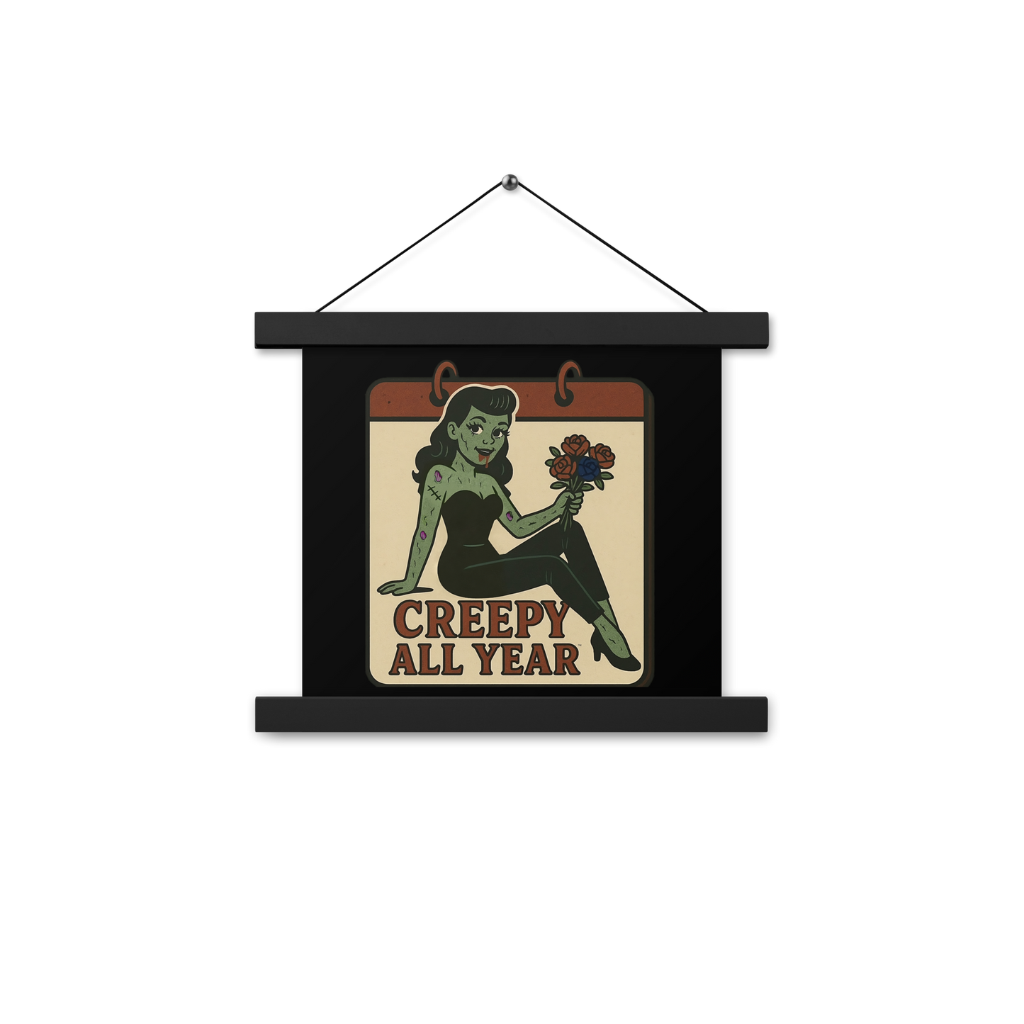 Black hanging wall art with two wood pieces on the top and bottom and a black hanger with a vintage-style patch on the design. The design features a green pinup-style zombie girl holding flowers, with a banner underneath that reads “CREEPY ALL YEAR.”