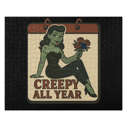 Black puzzle with a graphic design. The design features a green pinup-style zombie girl holding flowers, with a banner underneath that reads “CREEPY ALL YEAR.”