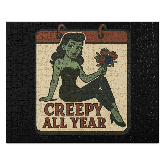 Black puzzle with a graphic design. The design features a green pinup-style zombie girl holding flowers, with a banner underneath that reads “CREEPY ALL YEAR.”