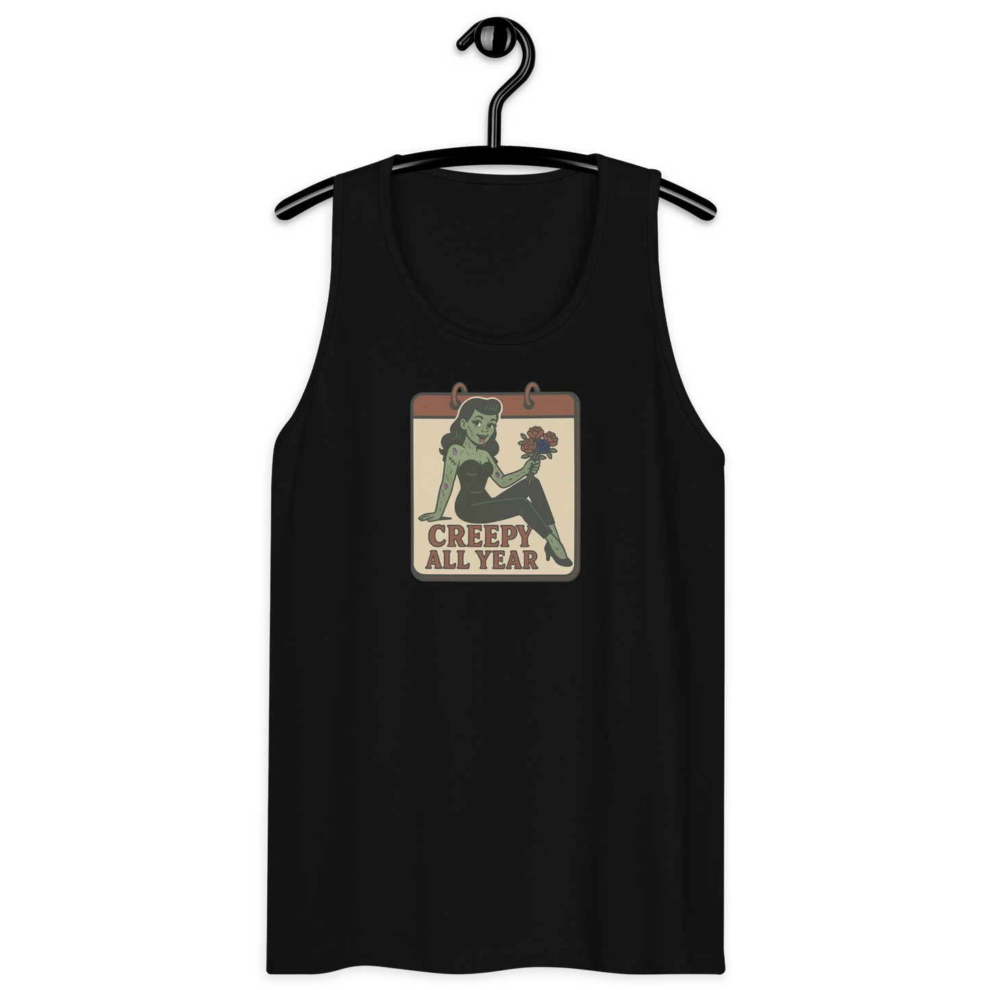 A black tank top on a hanger with a vintage-style design on the front. The design features a green pinup-style zombie girl holding flowers, with a banner underneath that reads “CREEPY ALL YEAR.”