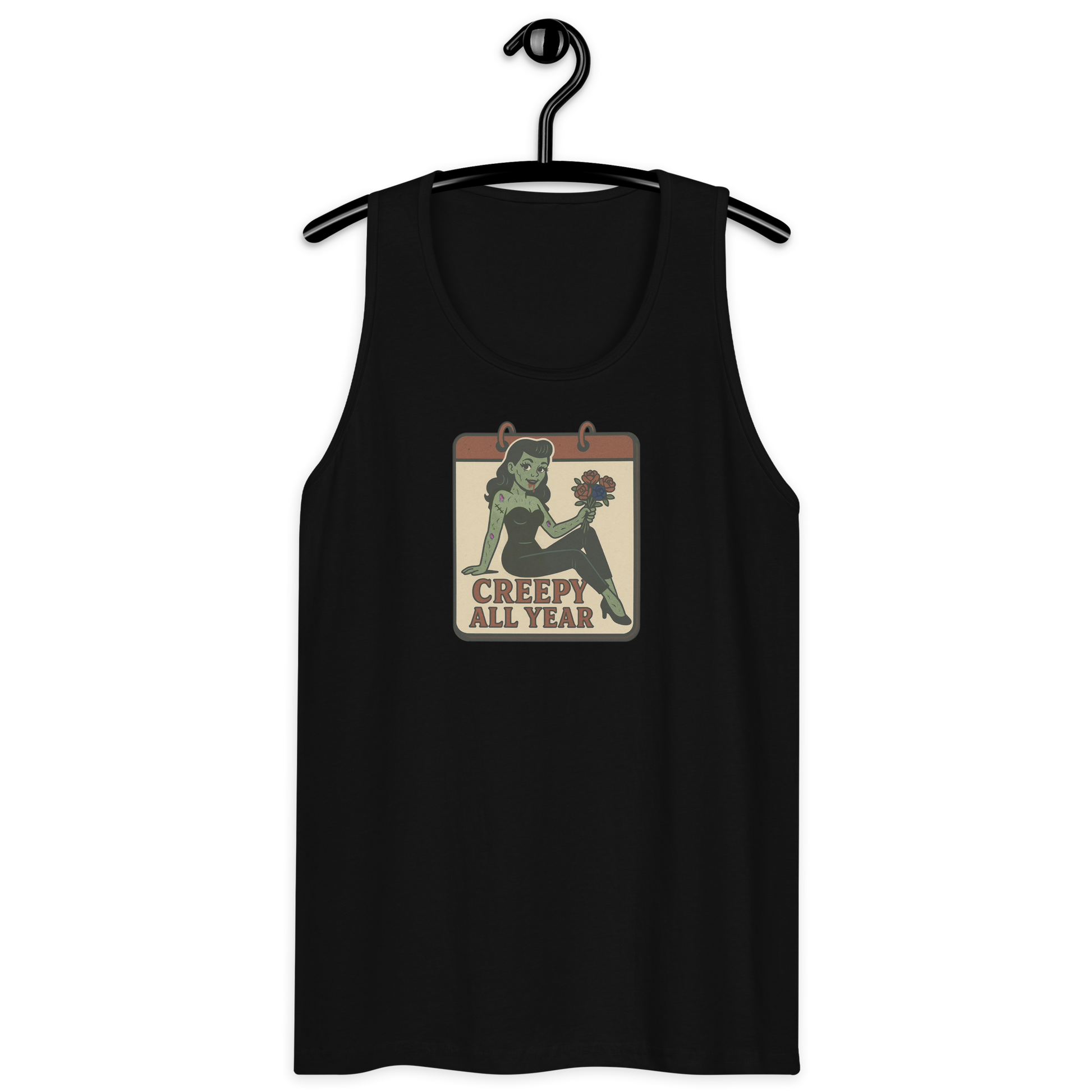 A black tank top on a hanger with a vintage-style design on the front. The design features a green pinup-style zombie girl holding flowers, with a banner underneath that reads “CREEPY ALL YEAR.”