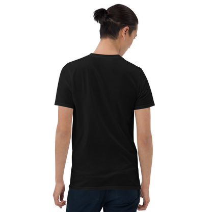 A man with black hair wearing jeans and t-shirt showing the back. The design on the front features a green pinup-style zombie girl holding flowers, with a banner underneath that reads “CREEPY ALL YEAR.”