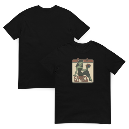A t-shirt with vintage style design showing both the front and back. The design on the front features a green pinup-style zombie girl holding flowers, with a banner underneath that reads “CREEPY ALL YEAR.”