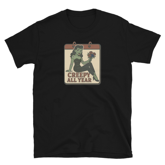 A black t-shirt with vintage style design. The design on the front features a green pinup-style zombie girl holding flowers, with a banner underneath that reads “CREEPY ALL YEAR.”