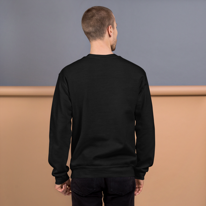 Man wearing a black sweatshirt against a gray and brown background