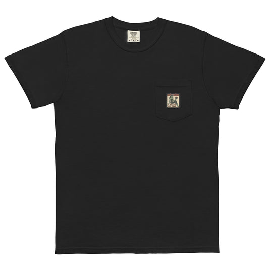 Black t-shirt with a small vintage-style patch on the pocket area. The patch features a green pinup-style zombie girl holding flowers, with a banner underneath that reads “CREEPY ALL YEAR.”
