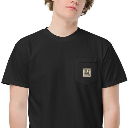 White male with light brown hair wearing a black t-shirt with a small vintage-style patch on the pocket area. The patch features a green pinup-style zombie girl holding flowers, with a banner underneath that reads “CREEPY ALL YEAR.”