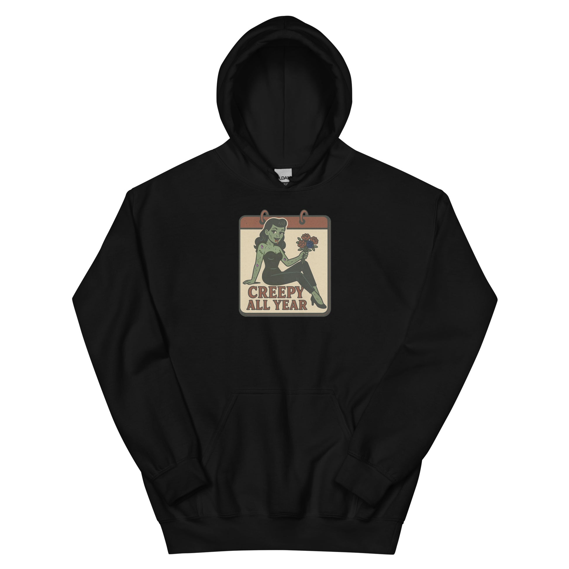 A black hoodie with a vintage-style design on the front. The design features a green pinup-style zombie girl holding flowers, with a banner underneath that reads “CREEPY ALL YEAR.”