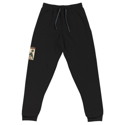 Black joggers with a vintage-style design on the front. The design features a green pinup-style zombie girl holding flowers, with a banner underneath that reads “CREEPY ALL YEAR.”