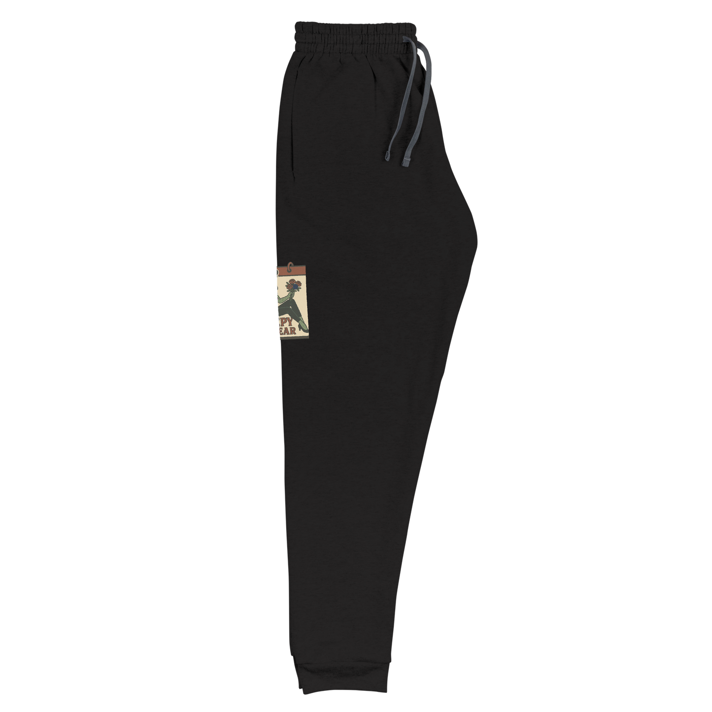 Black joggers that are folded, with a vintage-style design on the front. The design features a green pinup-style zombie girl holding flowers, with a banner underneath that reads “CREEPY ALL YEAR.”