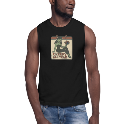 A man wearing jeans and muscle shirt with vintage style design. The design on the front features a green pinup-style zombie girl holding flowers, with a banner underneath that reads “CREEPY ALL YEAR.”