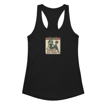 A black tank top with a vintage-style design on the front. The design features a green pinup-style zombie girl holding flowers, with a banner underneath that reads “CREEPY ALL YEAR.”