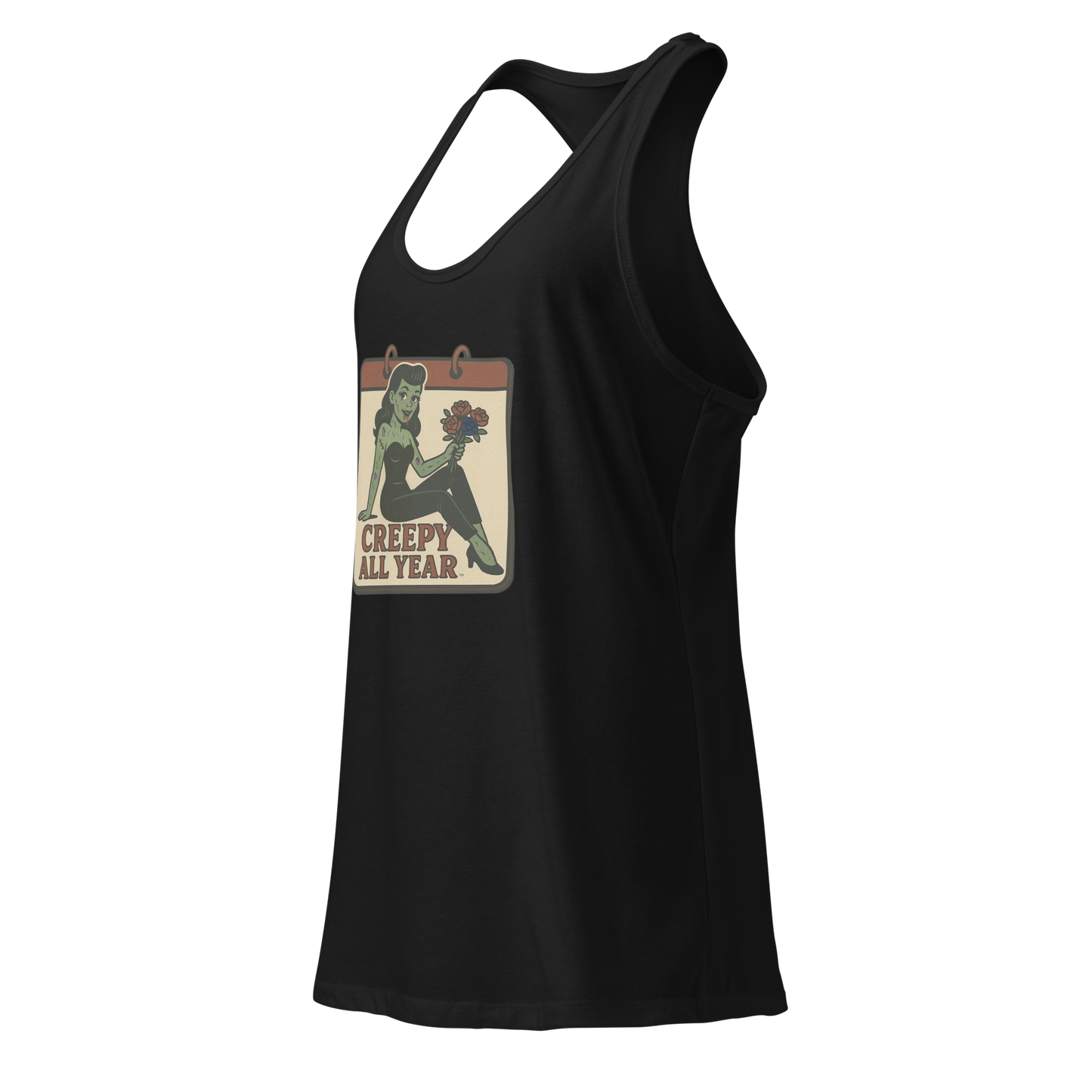 A black tank top side view with a vintage-style design on the front. The design features a green pinup-style zombie girl holding flowers, with a banner underneath that reads “CREEPY ALL YEAR.”