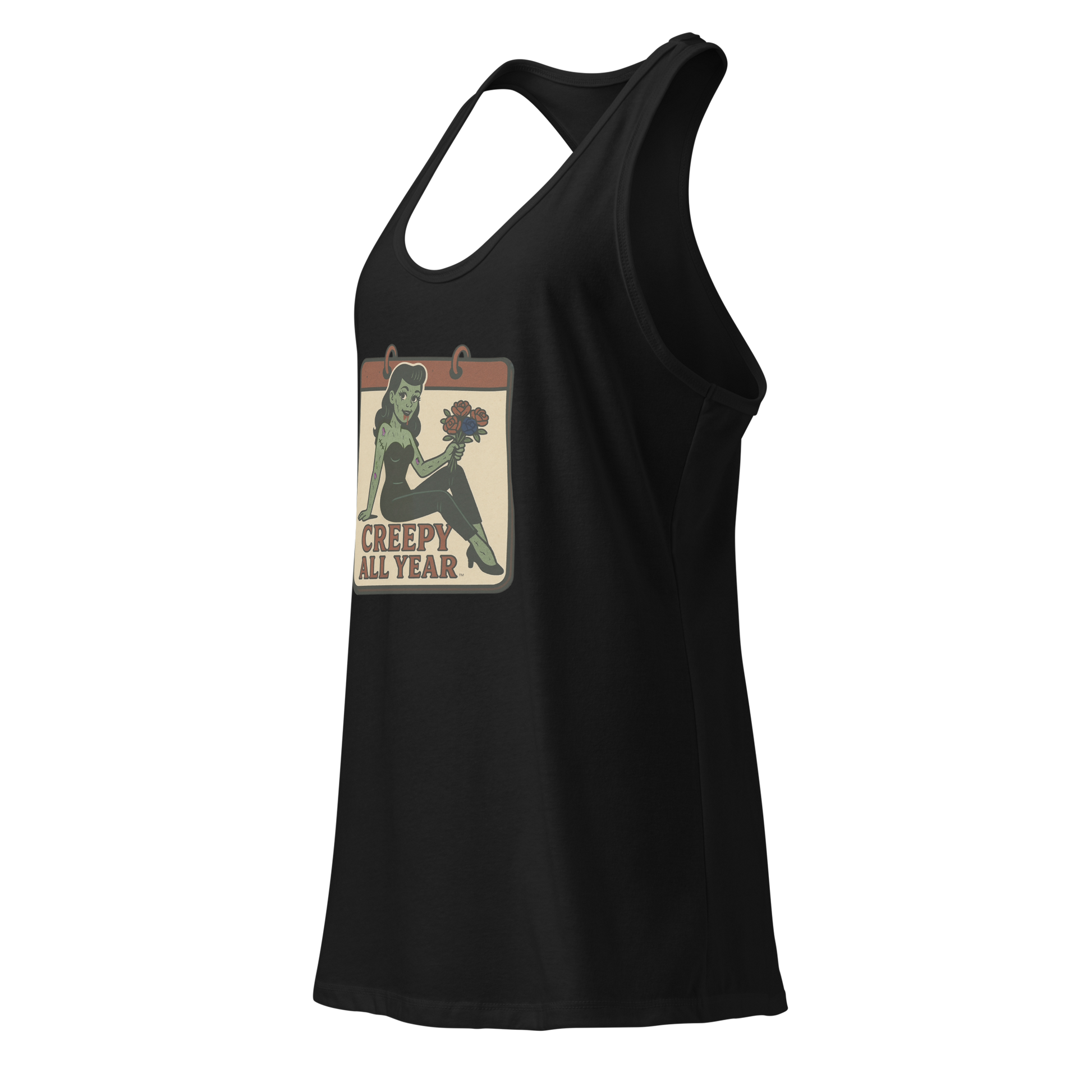 A black tank top side view with a vintage-style design on the front. The design features a green pinup-style zombie girl holding flowers, with a banner underneath that reads “CREEPY ALL YEAR.”