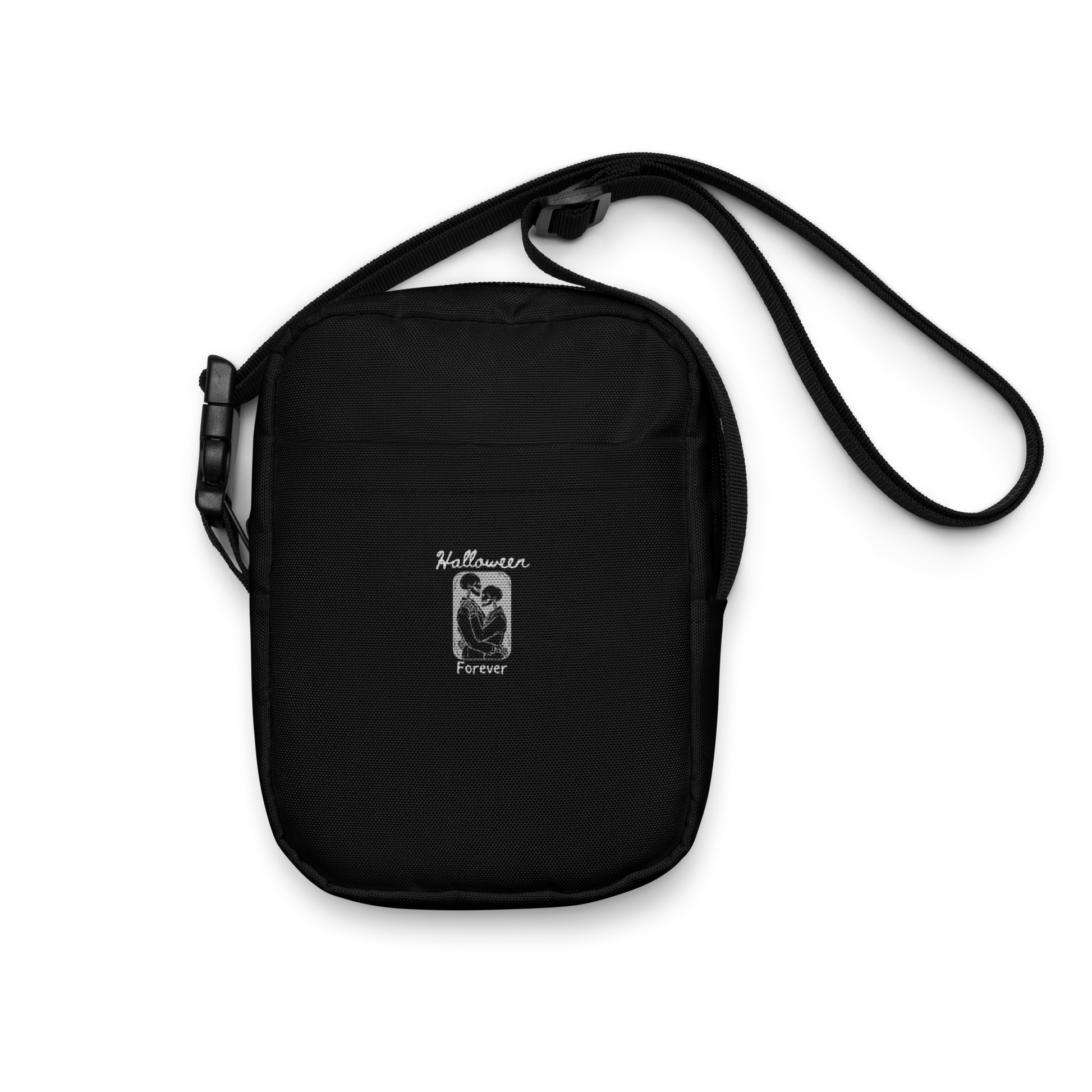 This is a black crossbody bag that has a hugging skeleton couple that is grey and says Halloween Forever 