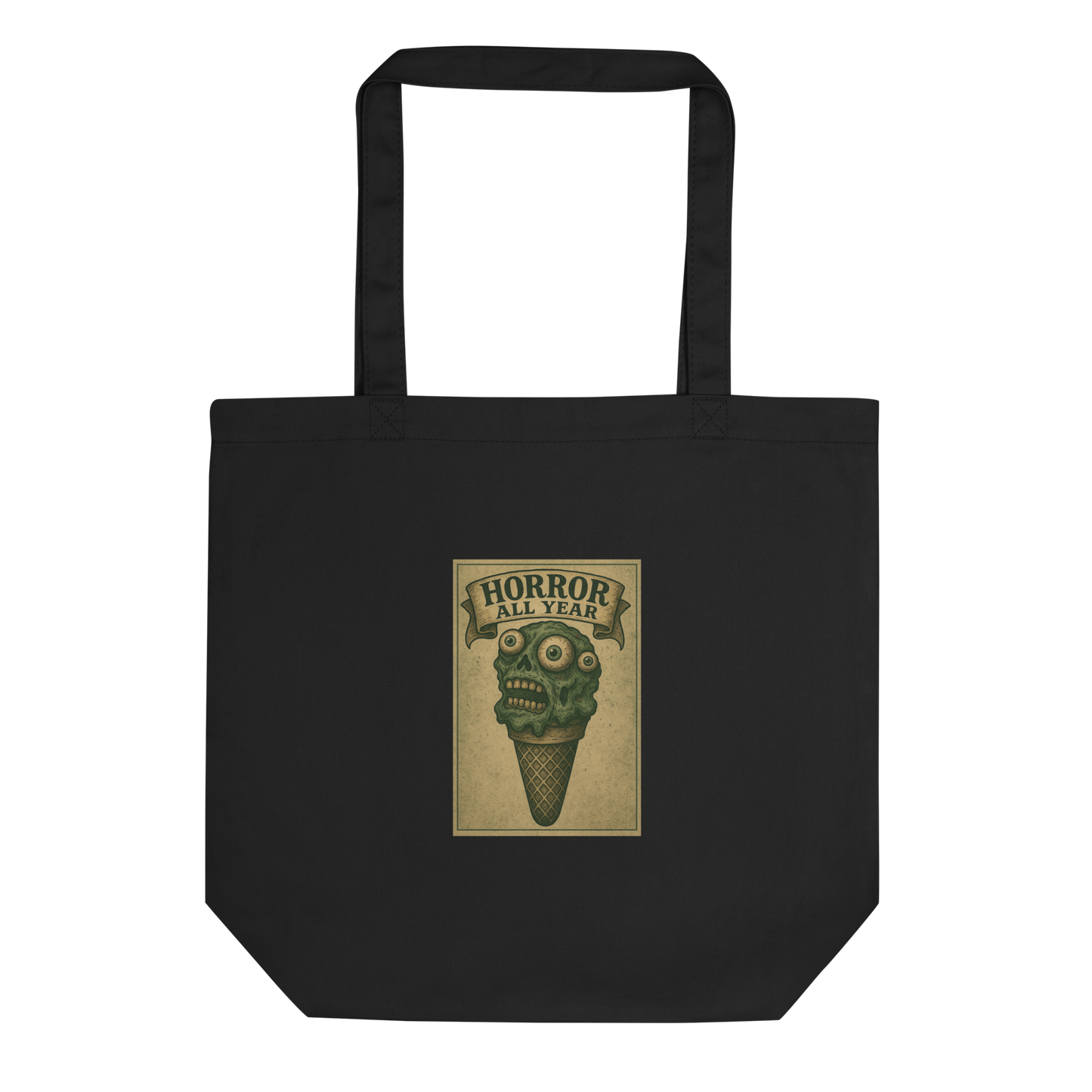 This is a black tote bag that is a vintage-style illustration of a zombie-themed ice cream cone with a green, melting undead face and bulging eyeballs. Above the cone, a horror banner reads "Horror All Year" on a distressed parchment background