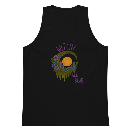 This is a black mens tank top with a design of a hand-drawn wreath made of moss-covered branches wraps around a glowing sun. The wreath is decorated with purple and blue flowers, small amethyst and fluorite crystals, and strands of hanging moss. The words “Witchy” curve above the wreath and “All Year” sits on the bottom right 
