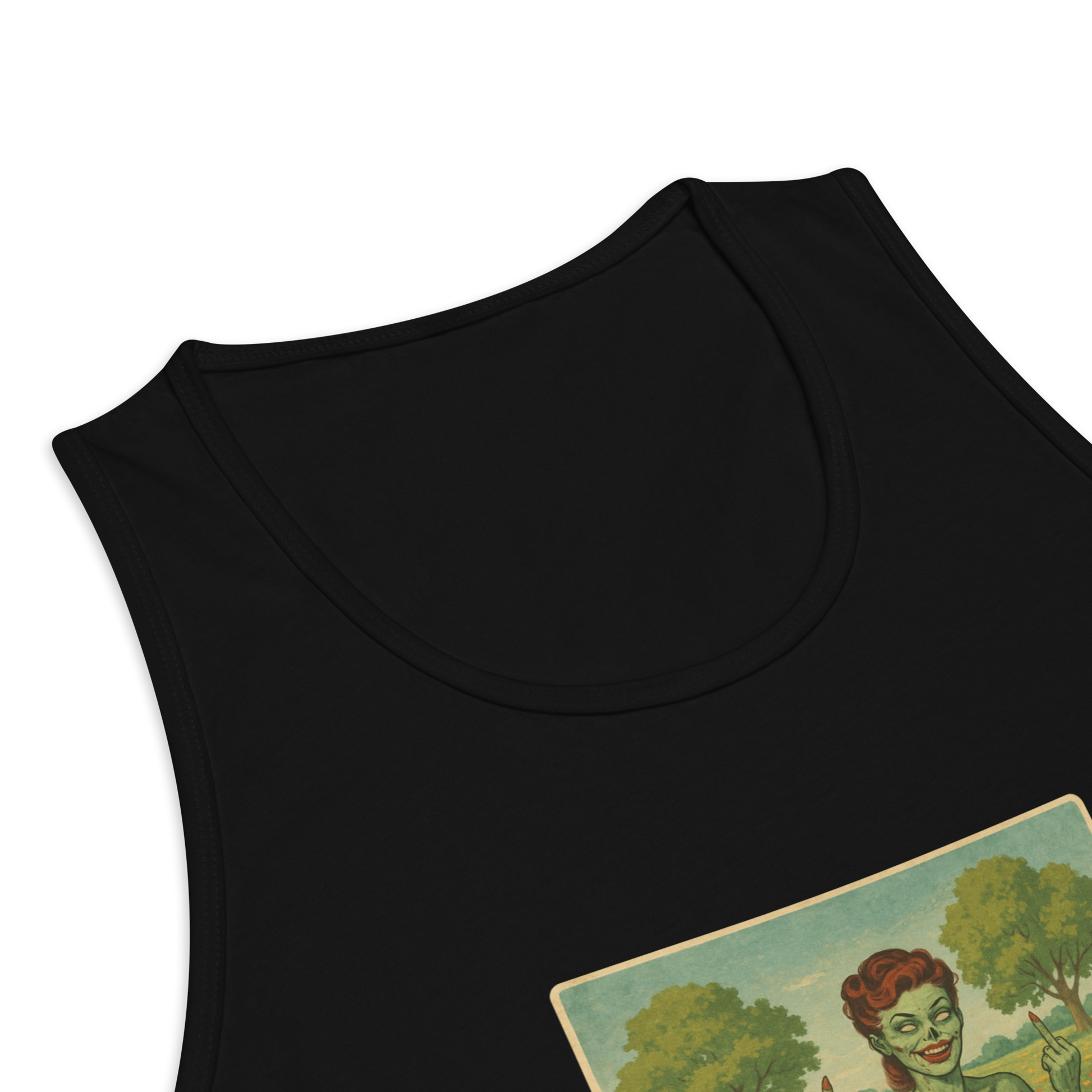This is a zoom in of a black tank top with a design illustration of a sassy zombie pinup girl standing in a floral field, wearing tattered lingerie and flipping off the viewer with both hands. She has green skin, vintage curls, and a bold attitude. The design blends horror and humor, with a pastel color palette and creepy cute vibes