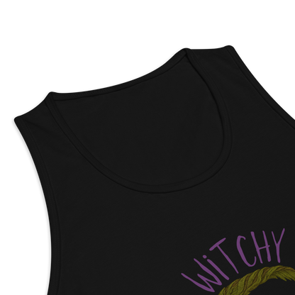 This is a zoom in of a black tank top with a design of a hand-drawn wreath made of moss-covered branches wraps around a glowing sun. The wreath is decorated with purple and blue flowers, small amethyst and fluorite crystals, and strands of hanging moss. The words “Witchy” curve above the wreath and “All Year” sits on the bottom right 
