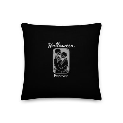 This is a black pillow that has a hugging skeleton couple that is grey and says Halloween Forever 