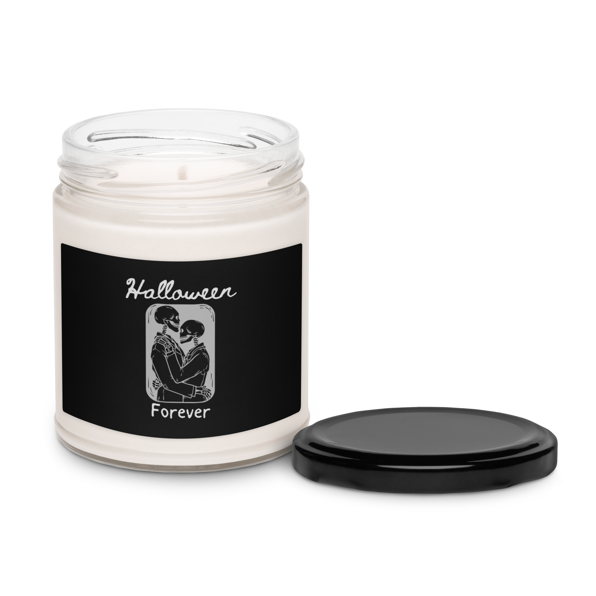 This is a candle with a black label and black lid that has a hugging skeleton couple that is grey and says Halloween Forever 