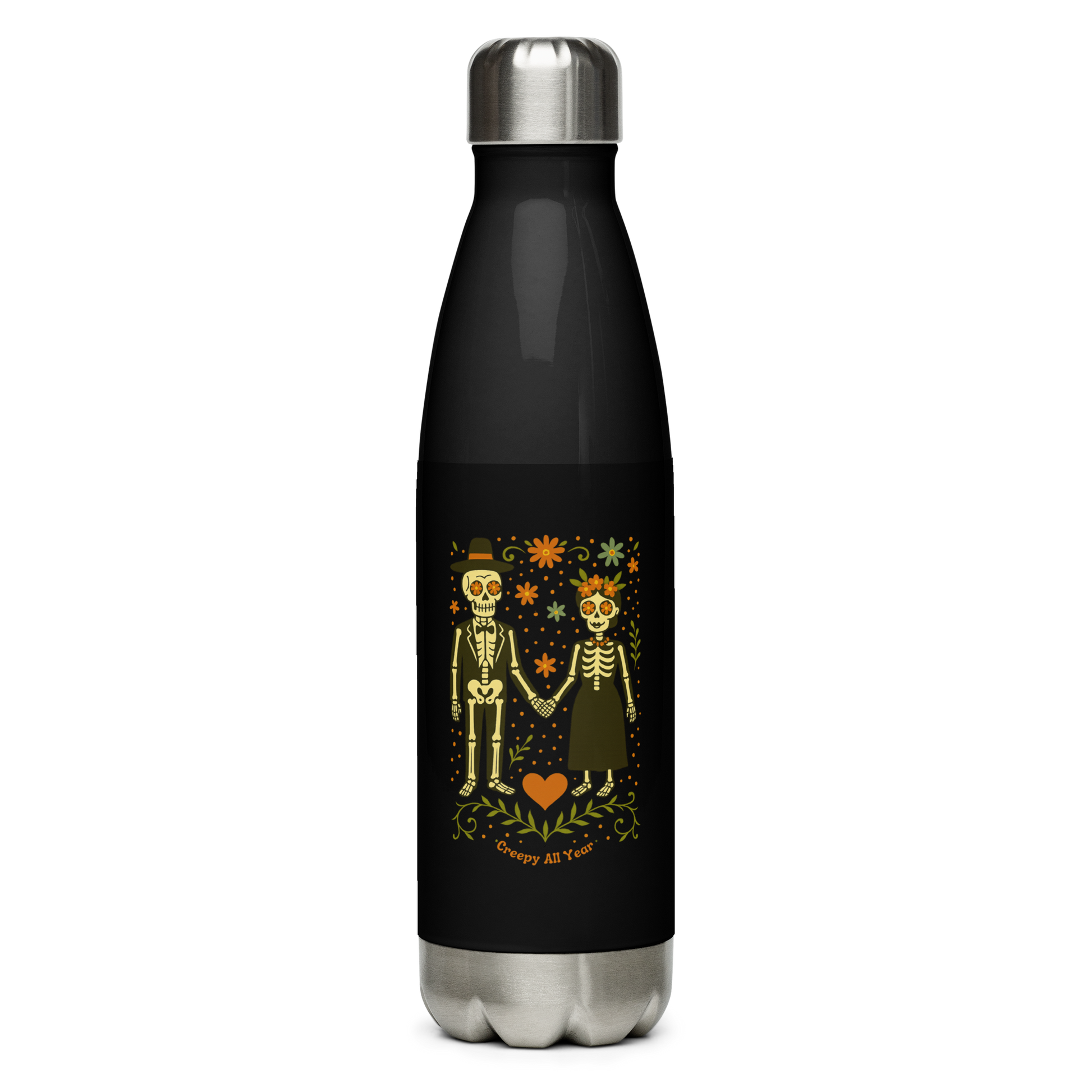 This is a black and stainless steel water bottle with a Día de los Muertos–style illustration of a male and female skeleton holding hands, surrounded by marigolds, vines, and folk art patterns. The skeletons wear traditional black clothing, the man in a suit and hat, the woman with a floral crown with a red heart and leaves at the bottom and the text Creepy All Year. Rendered in warm tones of orange, green, and cream, symbolizing eternal love and remembrance