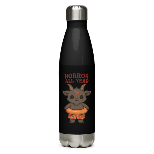 This is a black stainless steel water bottle with a cartoon illustration of a baby Baphomet goat with curved horns and a playful grin, wearing bright floral swim trunks while floating in a colorful inner tube. The character is set against a light background with the bold text “Horror All Year” above in red letters 