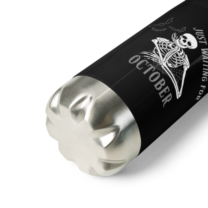This is a steel black water bottle that has a bored skeleton with his head resting in his hand and he has spider webs and bats around him and the text reads just waiting for October