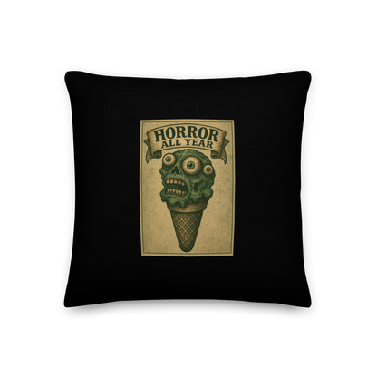 This is a pillow with a vintage-style illustration of a zombie-themed ice cream cone with a green, melting undead face and bulging eyeballs. Above the cone, a horror banner reads "Horror All Year" on a distressed parchment background