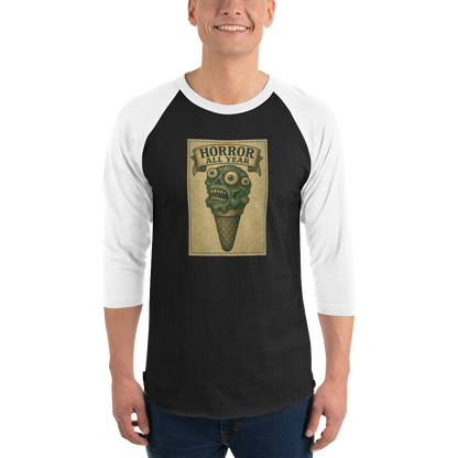 This is a man wearing jeans and a black and white raglan shirt that is a vintage-style illustration of a zombie-themed ice cream cone with a green, melting undead face and bulging eyeballs. Above the cone, a horror banner reads "Horror All Year" on a distressed parchment background