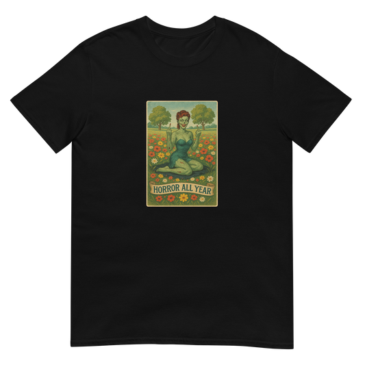 This is a black t-shirt with a design illustration of a sassy zombie pinup girl standing in a floral field, wearing tattered lingerie and flipping off the viewer with both hands. She has green skin, vintage curls, and a bold attitude. The design blends horror and humor, with a pastel color palette and creepy cute vibes