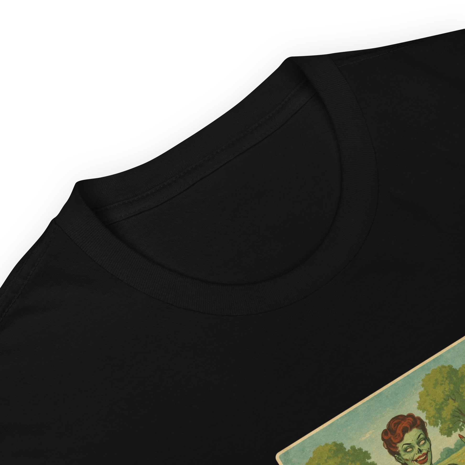 This is a zoom in of a black t-shirt with a design illustration of a sassy zombie pinup girl standing in a floral field, wearing tattered lingerie and flipping off the viewer with both hands. She has green skin, vintage curls, and a bold attitude. The design blends horror and humor, with a pastel color palette and creepy cute vibes