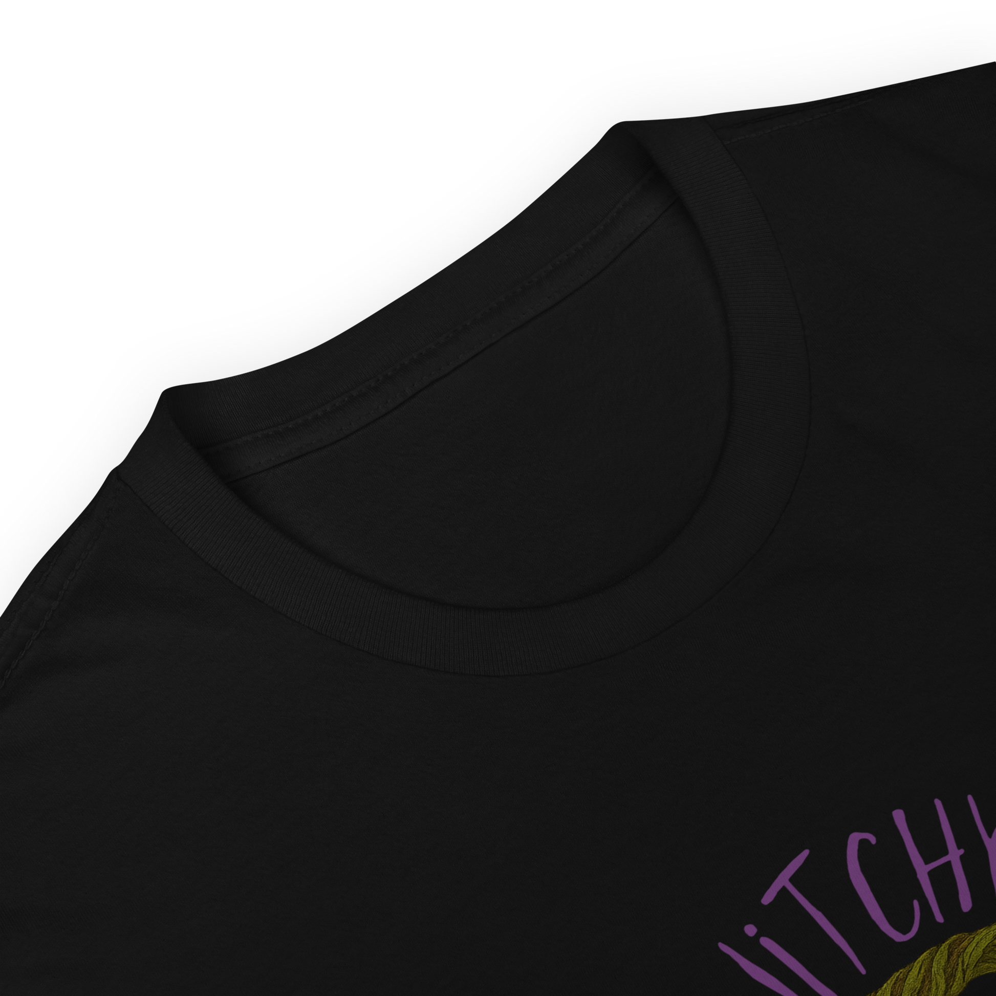 This is a zoom in of a black t-shirt with a design of a hand-drawn wreath made of moss-covered branches wraps around a glowing sun. The wreath is decorated with purple and blue flowers, small amethyst and fluorite crystals, and strands of hanging moss. The words “Witchy” curve above the wreath and “All Year” sits on the bottom right 