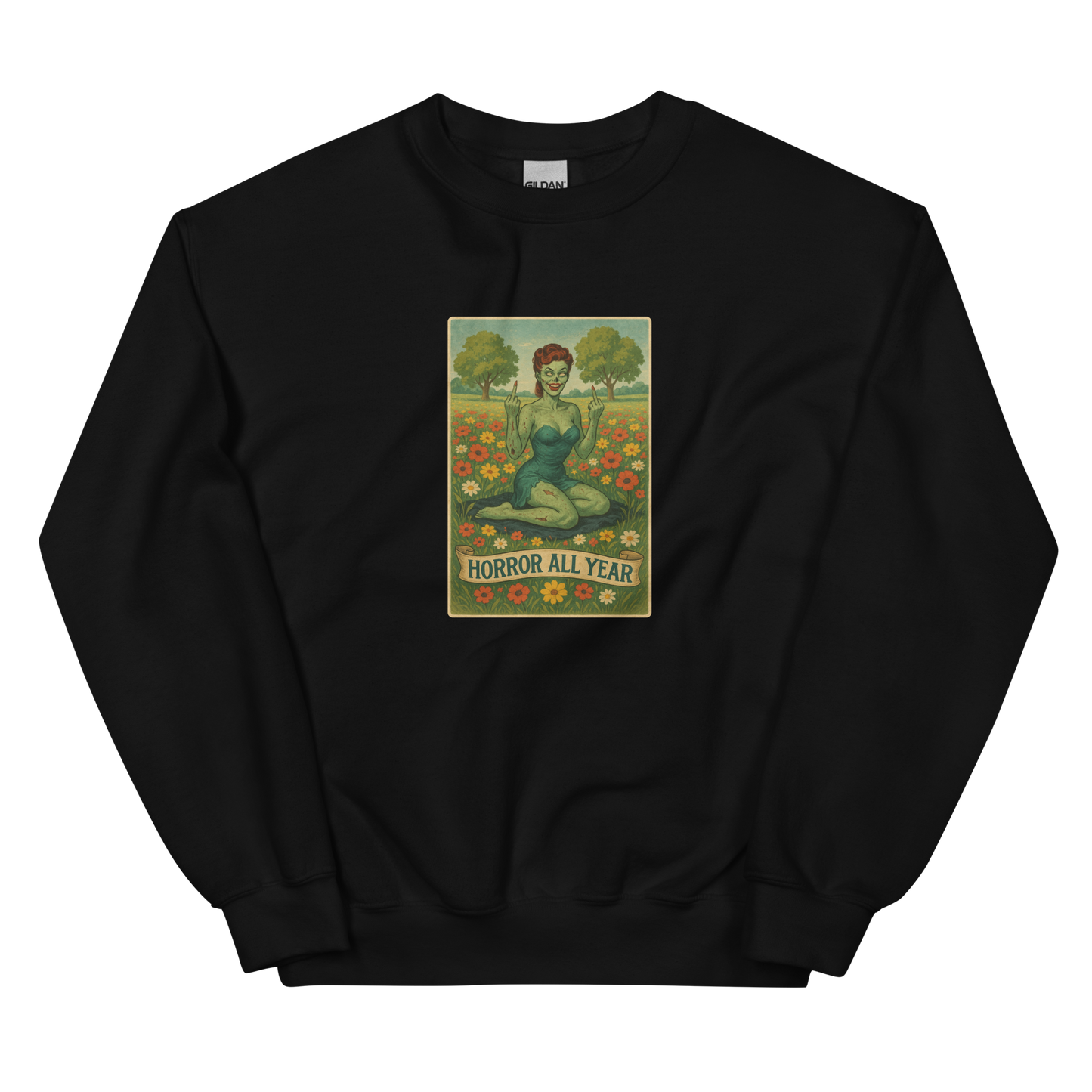 This is a black sweatshirt with a design illustration of a sassy zombie pinup girl standing in a floral field, wearing tattered lingerie and flipping off the viewer with both hands. She has green skin, vintage curls, and a bold attitude. The design blends horror and humor, with a pastel color palette and creepy cute vibes