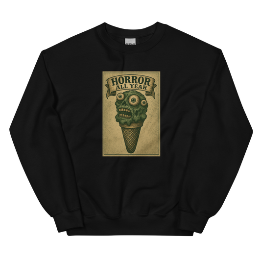This is a black sweatshirt that is a vintage-style illustration of a zombie-themed ice cream cone with a green, melting undead face and bulging eyeballs. Above the cone, a horror banner reads "Horror All Year" on a distressed parchment background