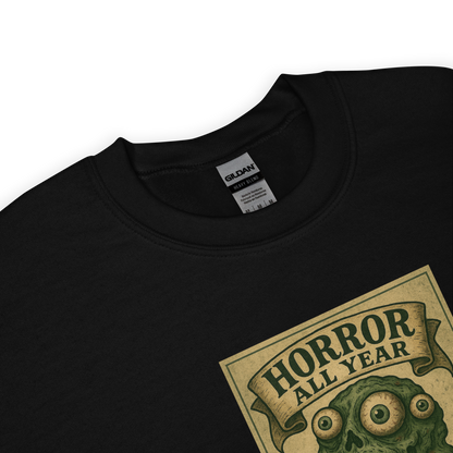 This is a zoom in of a black sweatshirt that is a vintage-style illustration of a zombie-themed ice cream cone with a green, melting undead face and bulging eyeballs. Above the cone, a horror banner reads "Horror All Year" on a distressed parchment background
