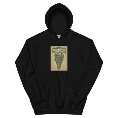 This a black hoodie that is a vintage-style illustration of a zombie-themed ice cream cone with a green, melting undead face and bulging eyeballs. Above the cone, a horror banner reads "Horror All Year" on a distressed parchment background