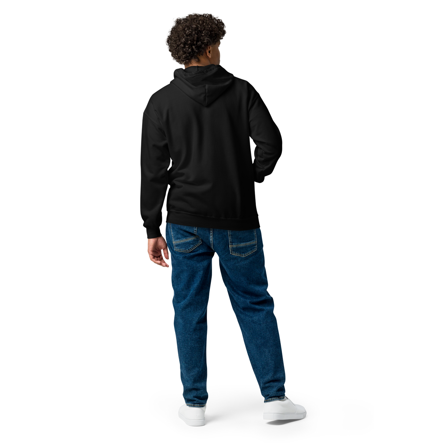 This is man showing the back of a black zip up hoodie with a Día de los Muertos–style illustration of a male and female skeleton holding hands, surrounded by marigolds, vines, and folk art patterns. The skeletons wear traditional black clothing, the man in a suit and hat, the woman with a floral crown with a red heart and leaves at the bottom and the text Creepy All Year. Rendered in warm tones of orange, green, and cream, symbolizing eternal love and remembrance on the front side