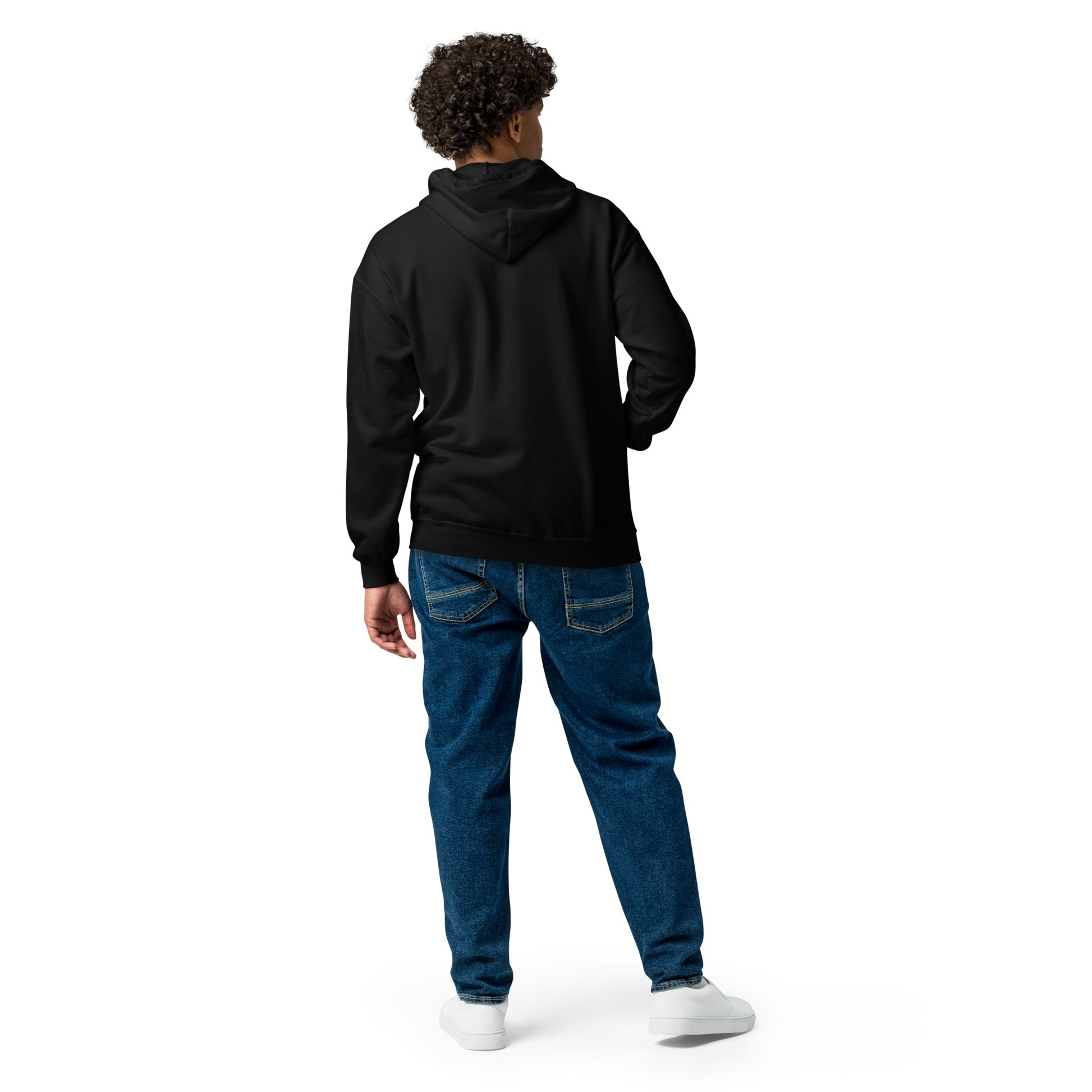 This is man showing the back of a black zip up hoodie with a Día de los Muertos–style illustration of a male and female skeleton holding hands, surrounded by marigolds, vines, and folk art patterns. The skeletons wear traditional black clothing, the man in a suit and hat, the woman with a floral crown with a red heart and leaves at the bottom and the text Creepy All Year. Rendered in warm tones of orange, green, and cream, symbolizing eternal love and remembrance on the front side