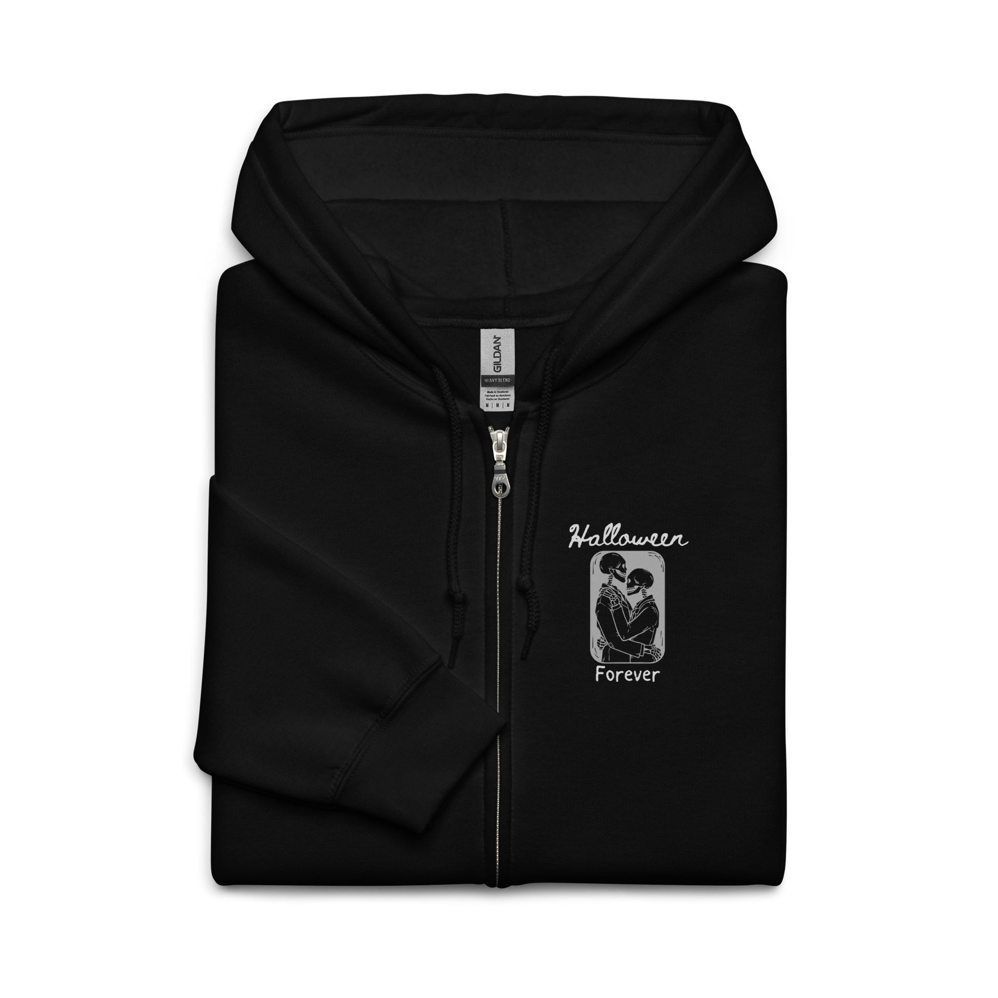 This is a folded black zip-up hoodie that has a hugging skeleton couple that is grey and says Halloween Forever 