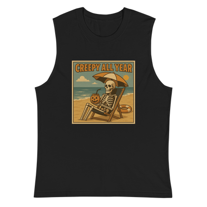 This is a black muscle shirt with a retro-style illustration of a grinning skeleton lounging on a beach chair under an orange umbrella. The skeleton is holding a pumpkin-shaped drink cup with a straw and relaxing by the ocean, with a bright sun in the sky and a life preserver in the sand. The words “Creepy All Year” appear boldly at the top 