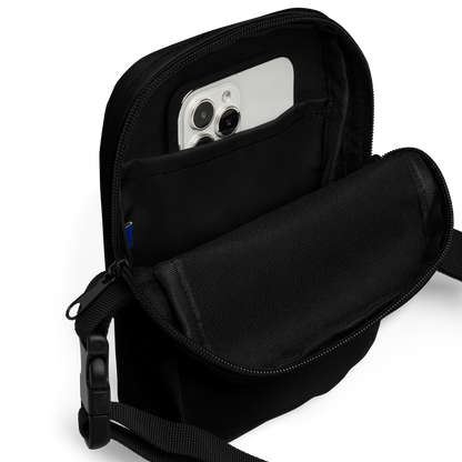 This is the inside of a black crossbody bag that is a vintage-style illustration of a zombie-themed ice cream cone with a green, melting undead face and bulging eyeballs. Above the cone, a horror banner reads "Horror All Year" on a distressed parchment background on the outside